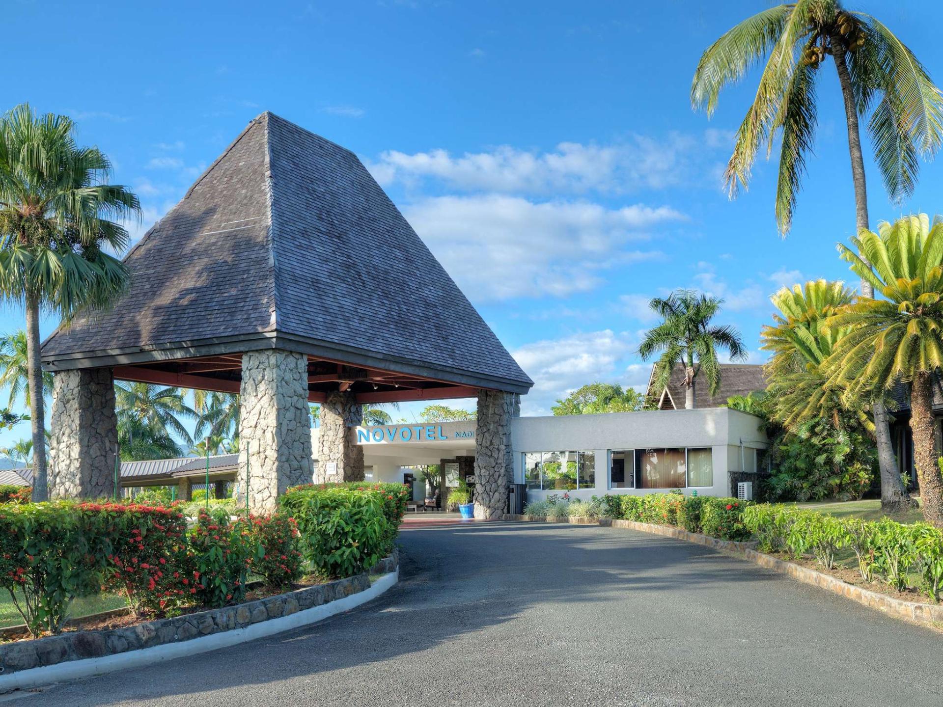 Novotel Nadi resort entrance with traditional Fijian bure roof